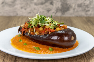 Full feast of the table with the eggplant aubergine featured up front to satisfy any vegan appetite