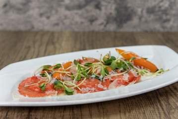 Tempting meal of handmade butternut squash ravioli served with romano pecorino cheese