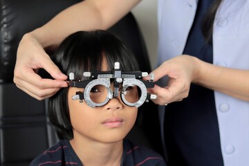 Girl eye test in clinic 