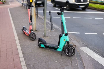two e-scooter parking at the side of the road © Christian Müller