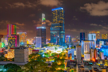 A city skyline at night with bright colourful lighting at Ho Chi Minh in Vietnam