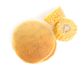 Stack of tasty corn pancakes and cobs isolated on white, top view