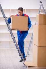 Young male contractor doing home relocation
