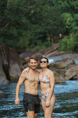 Fototapeta premium portrait of a fit couple enjoying the day at the river in australia
