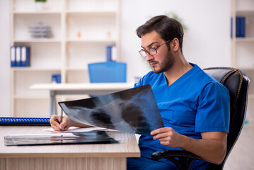 Young male doctor radiologist working in the clinic