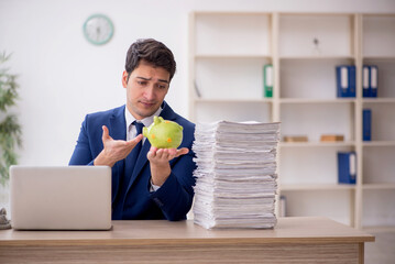 Young male employee in planning retirement concept