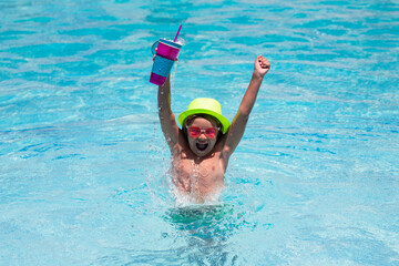 Child boy in swimming pool with cocktail. Kids swim on summer vacation. Beach sea and water fun. Summer kids cocktail.