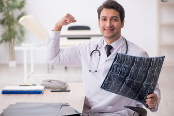 Young male doctor radiologist working in the clinic