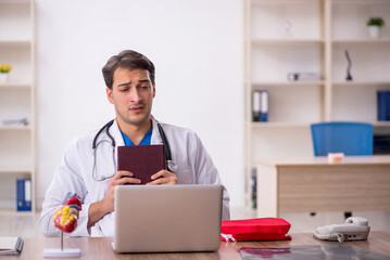 Young male doctor working in the clinic