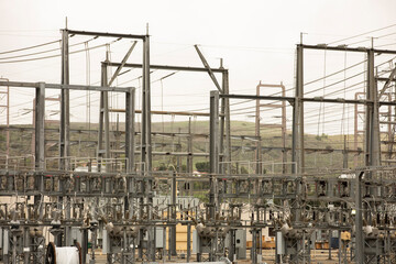 Daytime view of an electrical substation on a cloudy day.