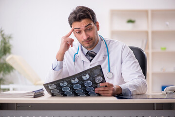 Young male doctor radiologist working in the clinic