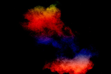 Colorful background of pastel powder explosion.Multi colored dust splash on black background.