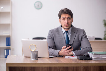 Young male employee working in the office