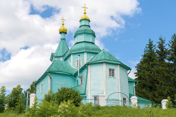 Ancient wooden church of the Descent of the Holy Spirit (1747) close-up on July afternoon. Plissy. Pskov region, Russia