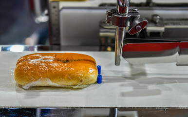 Automatic hamburger buns production line on conveyor belt equipment machinery in factory,...