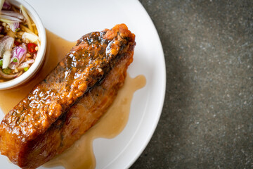 fried snapper fish with fish sauce and spicy salad