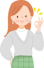 笑顔でOKサインをする若い女性