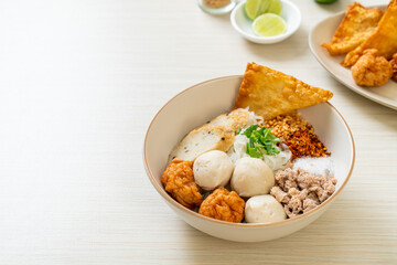 spicy small flat rice noodles with fish balls and shrimp balls without soup