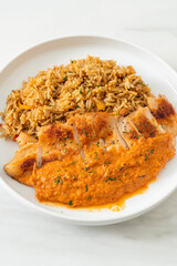 grilled chicken steak with red curry sauce and rice