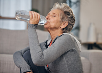 Drinking, water and fitness with a senior woman in her home for wellness, hydration or retirement....