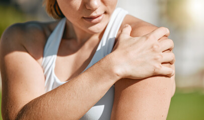 Closeup, exercise and woman with shoulder pain, outdoor and inflammation after training, workout and tension. Female, lady and athlete with muscle strain, ache and injury after practice and running