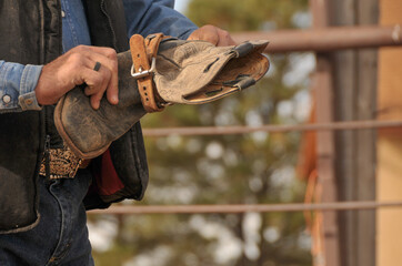 Cowboy Working on His Western Boot
