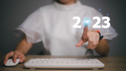 Business touching icon power on the 2023 virtual screen.ideas success and target and plan concept.