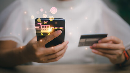 Shopping online payment concept. Woman hand using smart phone with cart delivery icon, banking and online shopping via banking mobile app, E-transaction and financial technology.
