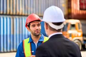 Foreman talking with manager at container site work for report progress of work directly