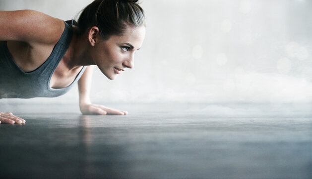 Fitness, Power And Woman Doing A Pushup At The Gym For Strength Training, Exercise And Workout. Motivation, Commitment And Girl Doing Cardio For Muscle, Strong Body And Performance With Mockup Space