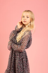 Fototapeta premium portrait of schoolgirl in dress