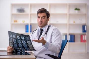 Young male doctor radiologist working in the clinic