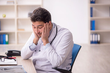 Young male doctor working in the clinic