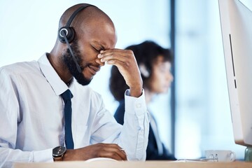 Depression, burnout and stress by call center worker, employee and customer service consultant in office. Pain, mental health and headache telemarking agent overworked and frustrated at the workplace