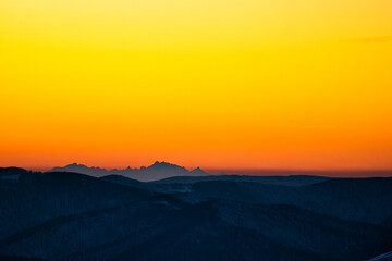 Temperature inversion in the mountains. The Tatra Mountains seen from the Polonina Wetlinska (Bieszczady, Poland). Distance about 170 km.
