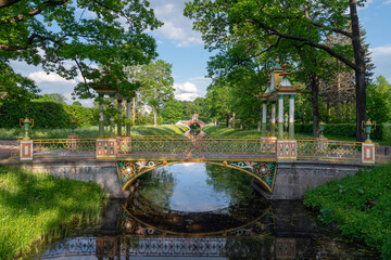 View of the Small Chinese Bridge in the Alexander Park of Tsarskoye Selo on a sunny summer day,...