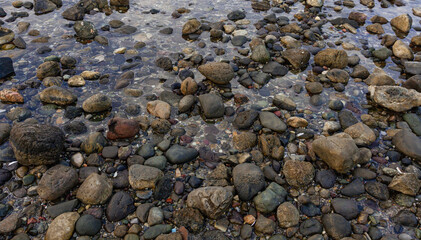Nature landscape, seafront. Stones on the seashore. Close up.