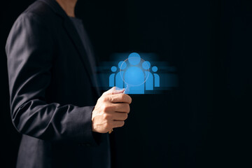 HRM or Human Resource Management, Magnifier glass focus to manager icon which is among staff icons for human development recruitment leadership and customer target group