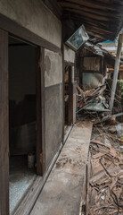 Fototapeta na wymiar Scary entrance of an abandoned traditional South-Korean house
