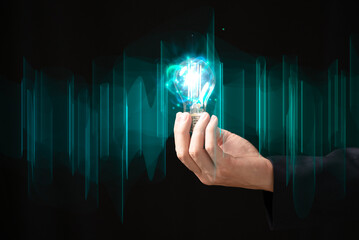 Businessman hand holding creative light bulb with power line technology, analysis solution and development, Modern business, Innovative of new ideas..
