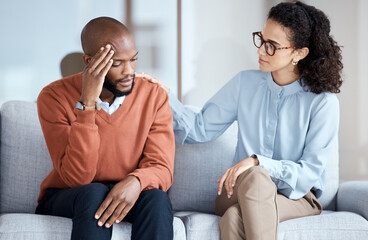 Therapy, counselling and mental health support for black man patient on psychologist couch. Person talking to woman therapist about psychology, anxiety and depression or stress for help or support