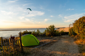 tent on the beach at sunset with paraglide view on the sea in Dune du Pilat camping in Landes France © Blogtrip
