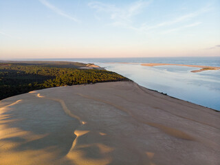 Sunset aerial view of Dune du Pilat with atlantic ocean and pine forest in Arcachon France
