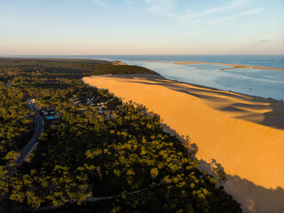 Dune du Pilat and marine pine forest at sunset aerial view at Bassin d'Arcachon France