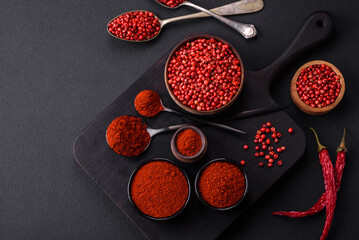 Spice smoked paprika in the form of powder in bowls and spoons