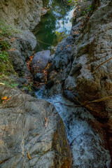 Obraz premium Waterfall in the deep forest on the top of the mountain.
