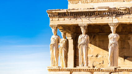 Porch of the Caryatids at temple of Athena Pollias or the Erechtheion at Acropolis site on a sunny evening in Athens Greece