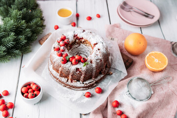 Bundt cake on white background with Christmas decoration