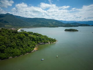 Fototapeta na wymiar Beautiful aerial view to green rainforest mountain on ocean shore