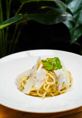 Spaghetti with parmesan cheese sauce Italian style in a restaurant
